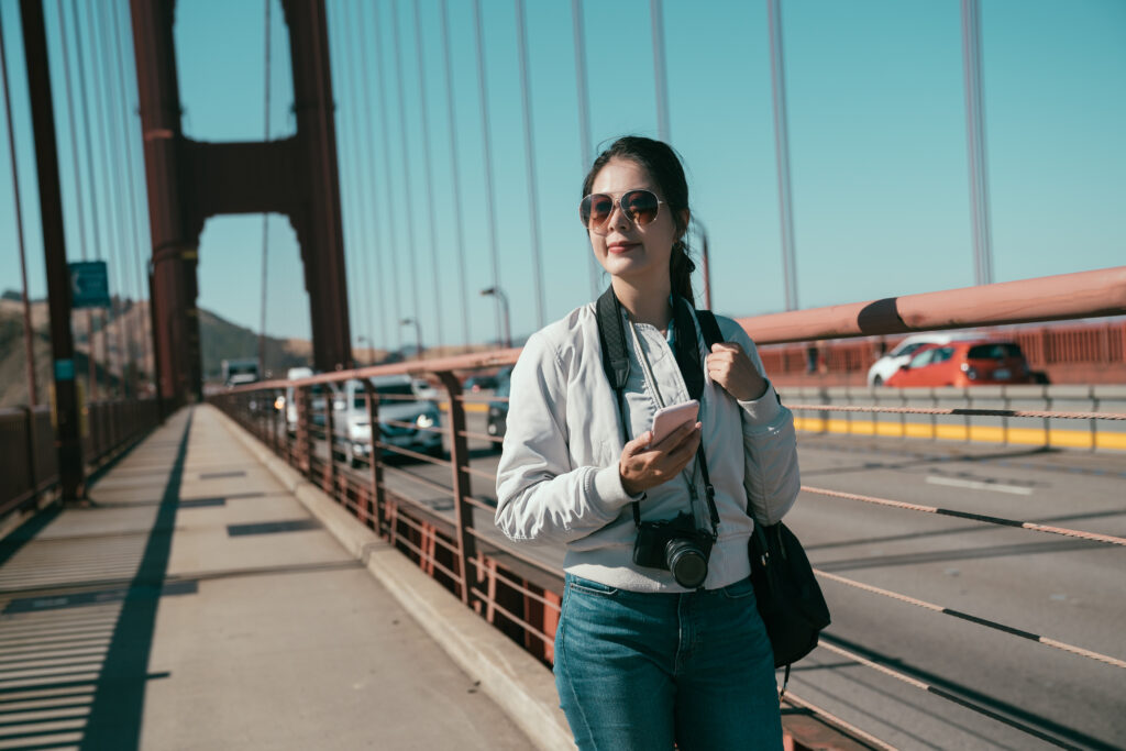 Best Self-Guided Freedom Trail Tour Apps Compared: Which One Should You Choose? 1 Happy,Young,Asian,Woman,Travel,Photographer,Holding,Cellphone,Walking,On